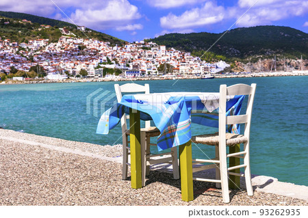 Greece travel. Typical fish tavern (restaurant) by the sea in Skopelos island. Sporades. 93262935