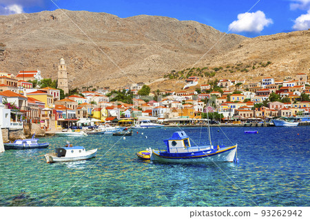 Greece travel and summer holidays. Charming typical greek islands of Dodecanese - beautiful colorful Chalki. 93262942