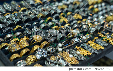 Gold and silver jewelry in store window display 93264089