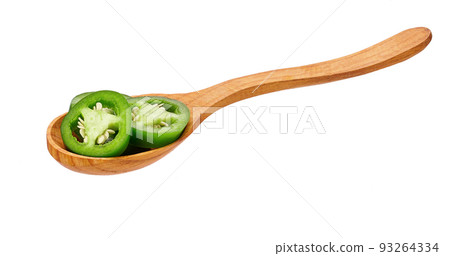 sliced green jalapeno pepper in wooden spoon isolated on white background, close-up. sliced green jalapeno pepper in wooden spoon isolated on white background, close-up. 93264334