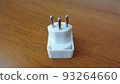 european swiss outlet plug on wood grain table 93264660