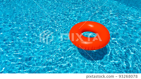 Brown ring floating in blue swimming pool. Inflatable ring, rest concept Brown ring floating in blue swimming pool. Inflatable ring, rest concept 93268078
