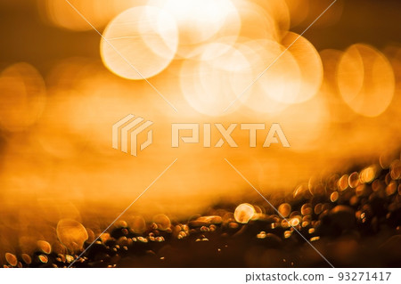 Abstract nature summer ocean sunset sea background. Small waves on water surface in motion blur with bokeh lights from sunrise. Holiday, vacation and recreational background concept. 93271417