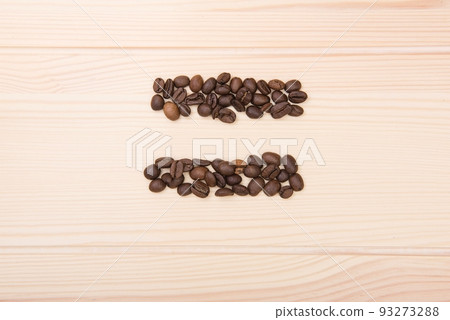 Wooden craft surface as a comfortable background wall or floor with different structures of light wood full of many aroma coffee beans. Equal sign shaped coffee beans. 93273288