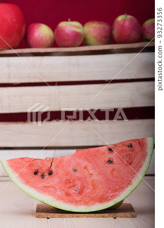 Wooden craft surface as a comfortable background wall and table with different structures. Full of different autumn fresh fruits and delicious red watermelon on the centre of the light wooden table. Wooden craft surface as a comfortable background wall and table with different structures. Full of different autumn fresh fruits and delicious red watermelon on the centre of the light wooden table. 93273356