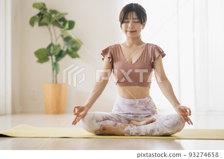 Woman doing yoga, woman meditating Woman doing yoga, woman meditating 93274658