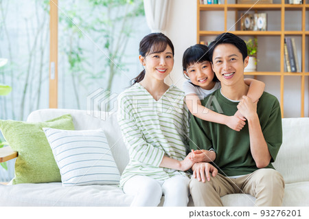 A young family relaxing in the living room A young family relaxing in the living room 93276201