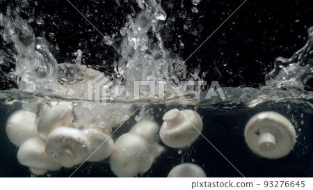 Mushrooms falling into the water with a splash Mushrooms falling into the water with a splash 93276645