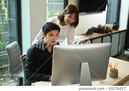 Team of young start up business people brainstorming and working together for new project at creative office Team of young start up business people brainstorming and working together for new project at creative office 93276827