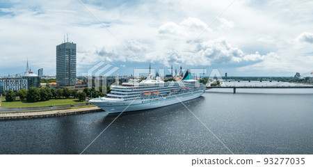 Beautiful cruise ship docked in Riga, Latvia near the old town and the bridge. Beautiful cruise ship docked in Riga, Latvia near the old town and the bridge. 93277035