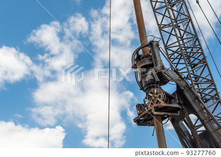Construction site blue sky and pile driver 93277760