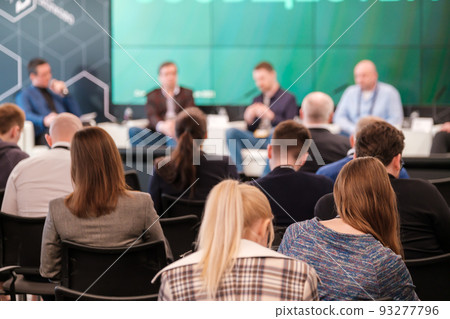 Group of people participating in business seminar in conference hall 93277796
