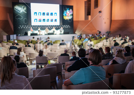 Business conference participants sitting in auditorium 93277873