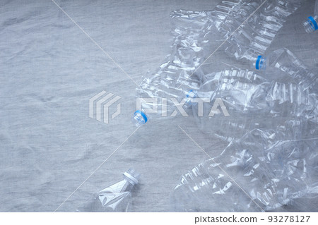 Scattered crushed plastic bottles and copy space 93278127