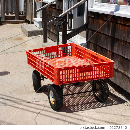 Red wagon left outside a store in Ocean Beach Village on Fire Island Red wagon left outside a store in Ocean Beach Village on Fire Island 93278840