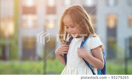 Shy preschooler girl goes to school with excited expression 93279265