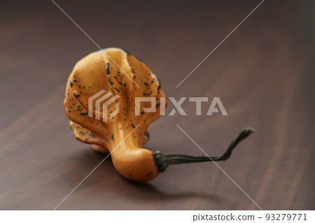 Decorative pear pumpkin on wood table Decorative pear pumpkin on wood table 93279771
