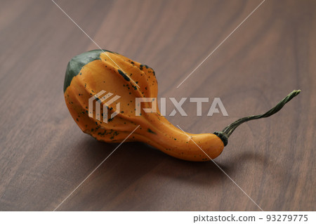 Decorative pear pumpkin on wood table Decorative pear pumpkin on wood table 93279775