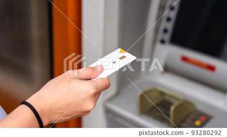 Atm machine cash. Money bank credit card holding hand. Withdraw money cash from atm. Bank credit card withdraw dollar bill. 93280292