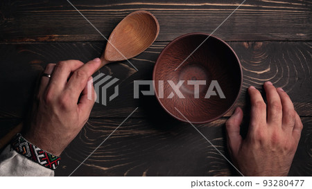 Ukrainian man sitting in national restaurant and waiting for order. Guy knocks fingers nervously on Ukrainian man sitting in national restaurant and waiting for order. Guy knocks fingers nervously on 93280477