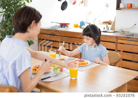 Family Mom and girl eating omelet rice Family Mom and girl eating omelet rice 93281076