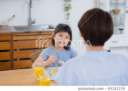 Family girl eating omelet rice Family girl eating omelet rice 93281159