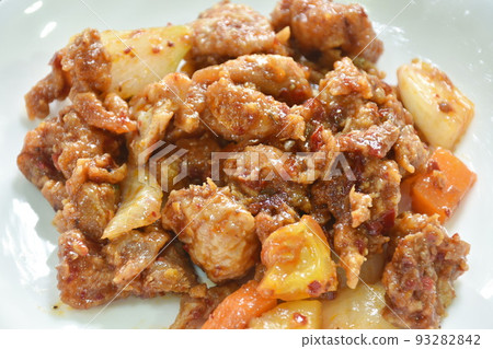 spicy stir fried chicken and bell pepper with chili paste on plate 93282842