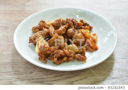 spicy stir fried chicken and bell pepper with chili paste on plate spicy stir fried chicken and bell pepper with chili paste on plate 93282843