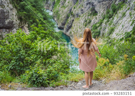 Woman tourist on background of purest waters of the turquoise color of the river Moraca flowing among the canyons. Travel around Montenegro concept Portrait of a disgruntled girl sitting at a cafe Woman tourist on background of purest waters of the turquoise color of the river Moraca flowing among the canyons. Travel around Montenegro concept Portrait of a disgruntled girl sitting at a cafe 93283151