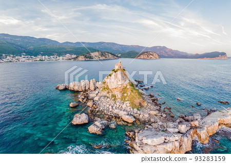 Sveta Nedelja is an islet on the Adriatic Sea, in Montenegrin municipality of Budva. It is located opposite the town of Petrovac na Moru in Montenegro. It has a small church on it Portrait of a 93283159