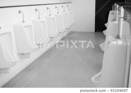 Black and white image concept, Male urinal room, Male toilet, Male toilets are not clean. Causing infection easily, White urine sanitary ware in a clean building for men. 93284697