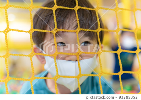 Boy playing in the ball pool Boy playing in the ball pool 93285352