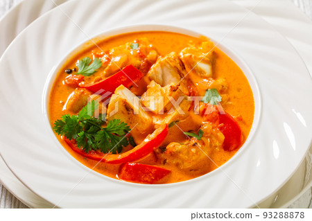 Fish Stew cooked with coconut milk and veggies Fish Stew cooked with coconut milk and veggies 93288878