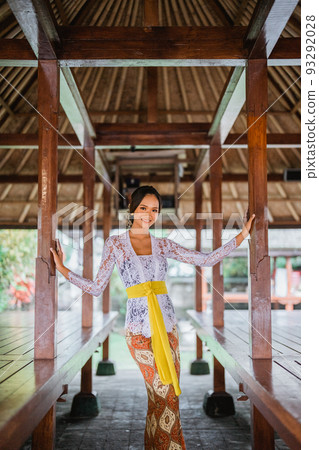 attractive balinese woman wearing white kebaya dress 93292028