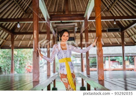 balinese young woman pose to camera and smile balinese young woman pose to camera and smile 93292035