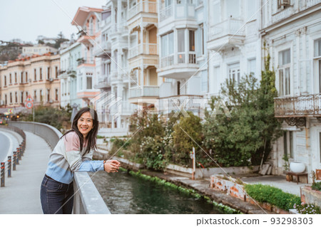 woman enjoying the beauty of building in arnavutkoy woman enjoying the beauty of building in arnavutkoy 93298303