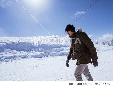 man walking on top of the snowy mountain in bursa turkey man walking on top of the snowy mountain in bursa turkey 93298379