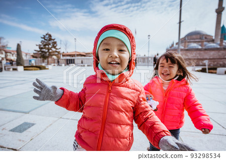happy kid running around the square in city centre of konya turkey happy kid running around the square in city centre of konya turkey 93298534