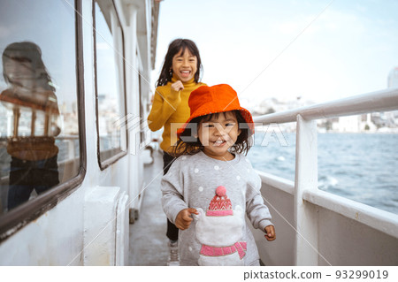little girl running around the ferryboat 93299019