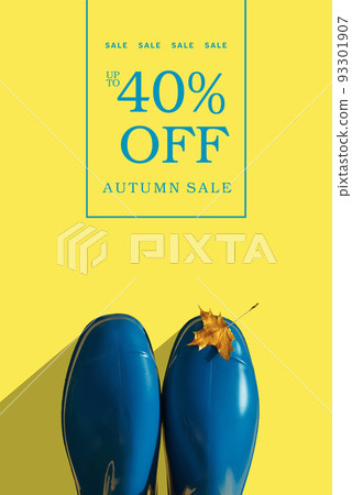 Blue rubber boots with autumn golden maple leaf on yellow background with typography 93301907