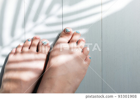 Women's feet with a pedicure Summer image 93301908