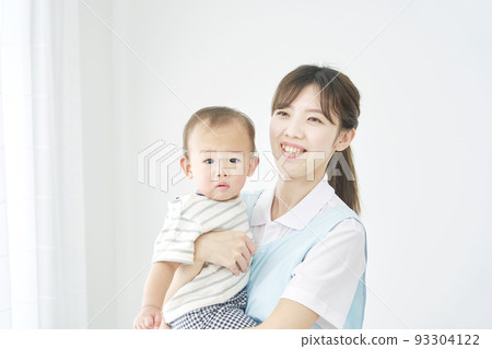 Child nurse holding a baby Child nurse holding a baby 93304122