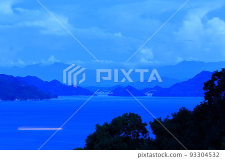 Overlooking the Seto Inland Sea, Tobishima, and the Shikoku Mountains from Oshiba Island at dusk 93304532
