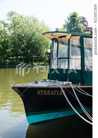 Boats moored on the River Thames in Old Windsor outside London 93305369
