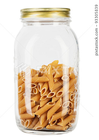 Whole Grain penne pasta from durum wheat in jar isolated on white background. 93305839