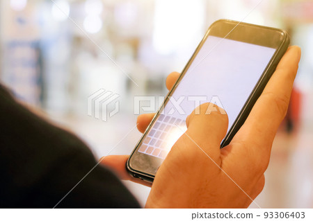 Closeup Image of man checking his phone Closeup Image of man checking his phone 93306403