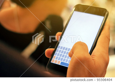 man checking his phone 93306404