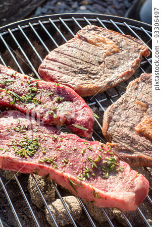 Home party garden barbecue Steak placed on charcoal fire Home party garden barbecue Steak placed on charcoal fire 93306497