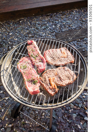 Home party garden barbecue Steak placed on charcoal fire Home party garden barbecue Steak placed on charcoal fire 93306501