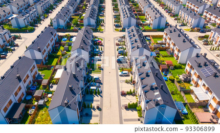 An aerial view of the houses and streets. A residential area in the suburbs.  93306899